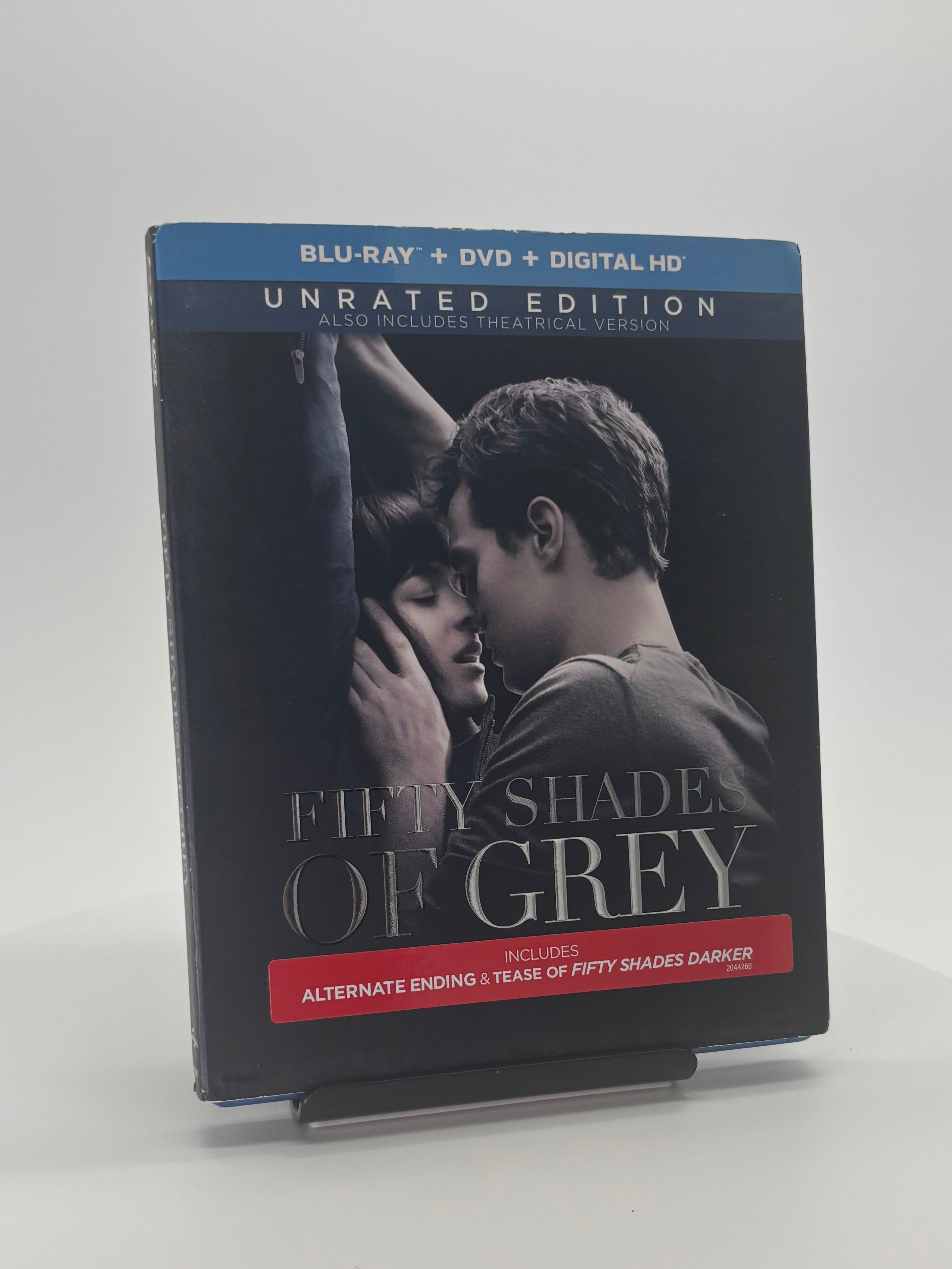Blu-ray and DVD cover of 'Fifty Shades of Grey' on a white surface